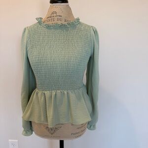 Long sleeved peplum shirt